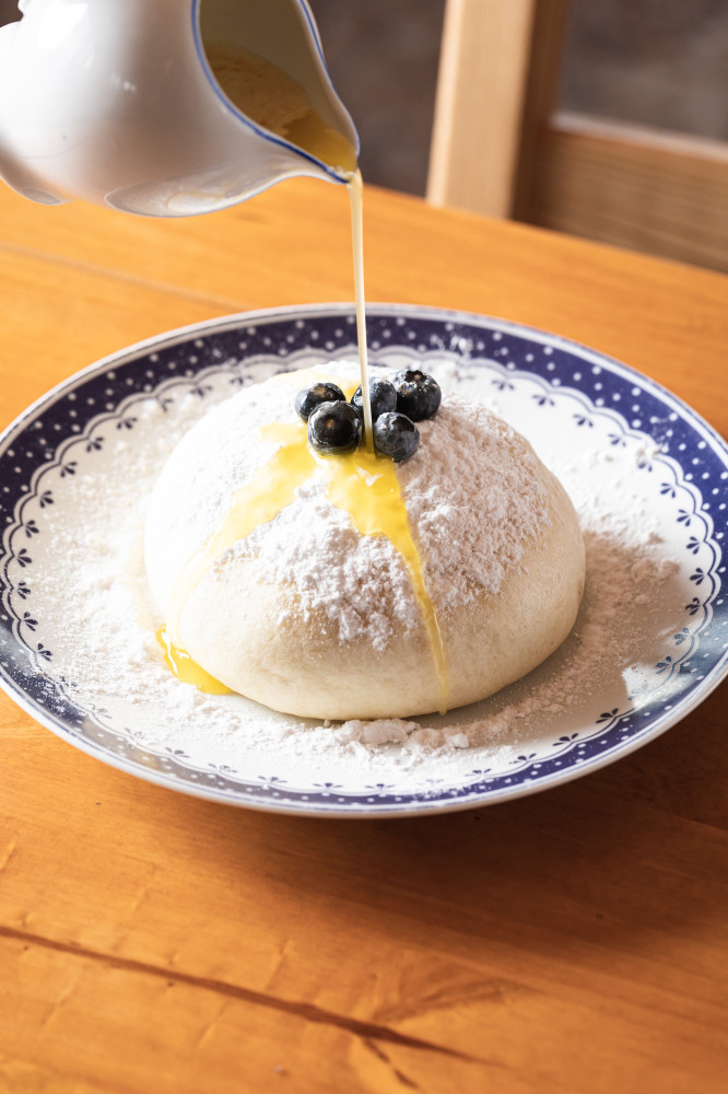 Homemade blueberry dumpling with sugar and melted butter